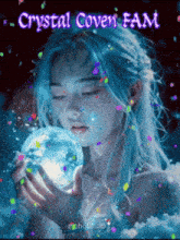 a woman with blue hair is holding a crystal sphere in her hand