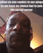 a man with a bandana on his head is making a funny face while talking to someone .