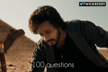 a picture of a man in the desert with the words 100 questions