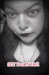 a black and white photo of a woman with the words see you in hell on the bottom