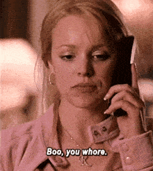 a woman is talking on a cell phone and says boo you whore ..