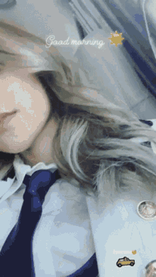 a woman wearing a blue tie and a white shirt says " good morning "
