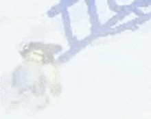 a blurred image of a person skiing down a snowy hill .