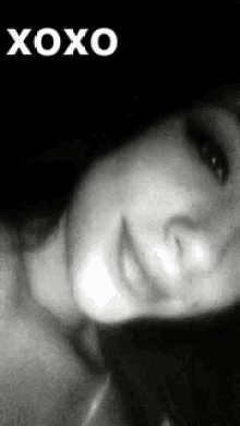 a black and white photo of a woman with the words xoxo on the top