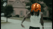 a person with a pumpkin face on their face