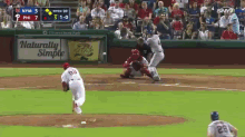a baseball game is being played with a naturally simple ad in the outfield