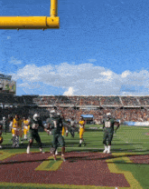a football game is being played at a stadium with a sign that says ' liberty ' on it