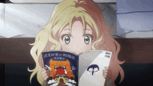 a girl is reading a book with chinese writing on the cover