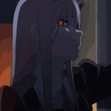 a close up of a girl with red eyes