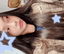 a girl with long hair and a hat behind her