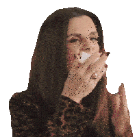 a woman wearing a leopard print jacket is covering her mouth with her hands