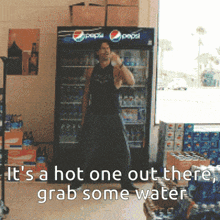 a man dancing in front of a pepsi cooler