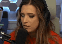 a woman wearing headphones is talking into a microphone and the words sweettalks are on the bottom