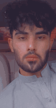 a man with a beard and a nose ring