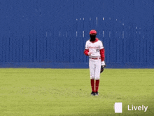 a baseball player wearing a mask and a houston jersey stands on a field