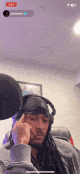 a man wearing headphones and a bandana with the name zaeffrance on the bottom right