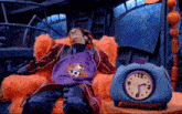 a man in a purple apron is sleeping in a chair next to a blue clock that says 12
