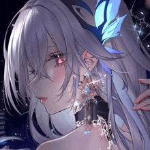 a close up of a girl 's face with a butterfly in her hair