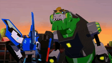 a group of transformers standing next to each other with one being a dinosaur
