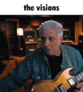 a man playing a guitar with the words " the visions " on the bottom
