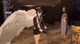 a person with angel wings is standing next to a penguin with the number 00 on its head