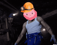 a man wearing a hard hat has a pink cube on his face