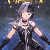 a girl in a black dress and gloves smiles