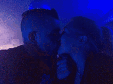 a man and a woman are kissing in a pixelated painting