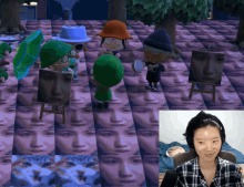 a woman in a plaid shirt is sitting in front of a video game screen