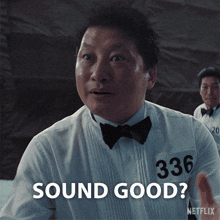 a man in a tuxedo with the number 336 on his shirt