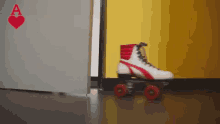 a pair of roller skates is standing in front of a door with a heart on it