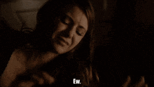 a close up of a woman 's face with the words ew visible