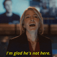 a woman says " i 'm glad he 's not here " in yellow letters