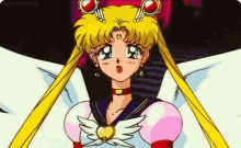 sailor moon from sailor moon is wearing a pink and white dress with wings and a heart on her chest .