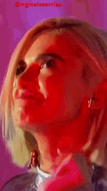 a close up of a woman 's face with the words omgmelosorriso written on the bottom