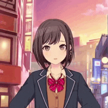 a girl in a school uniform with a red bow tie is standing in front of a city street .