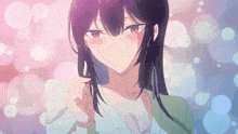 a girl with dark hair and red eyes is looking at the camera