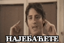 a shirtless man covering his ears with his hands and the words najebatete written on the bottom