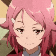 a close up of a girl 's face with pink hair and a blue shirt .