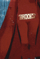 a woman in a red outfit has a belt that says brooks