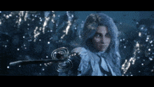 a woman with blue hair is holding a sword in her hand