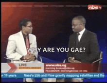 two men are sitting in front of a screen that says ' why are you gae '