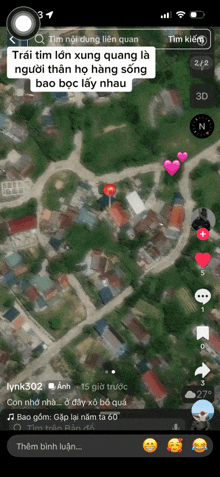 a phone screen shows a map of a town with hearts on it
