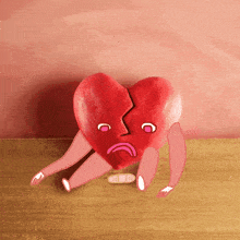 a broken heart with a bandage on it 's leg