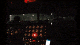 a cockpit of an airplane with a red light on it