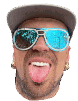 a man wearing sunglasses and a hat sticks out his tongue