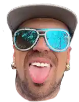 a man wearing sunglasses and a hat sticks out his tongue