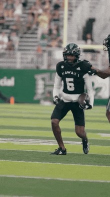 a football player wearing a jersey with the number 5 on it