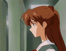 a close up of a girl 's face with a ponytail .