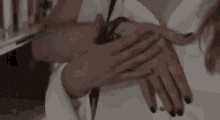 a man and a woman are holding hands in a room .
